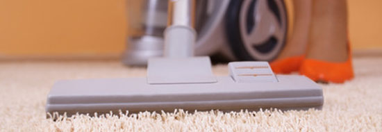 cleaning cleaning a carpet with a hoover